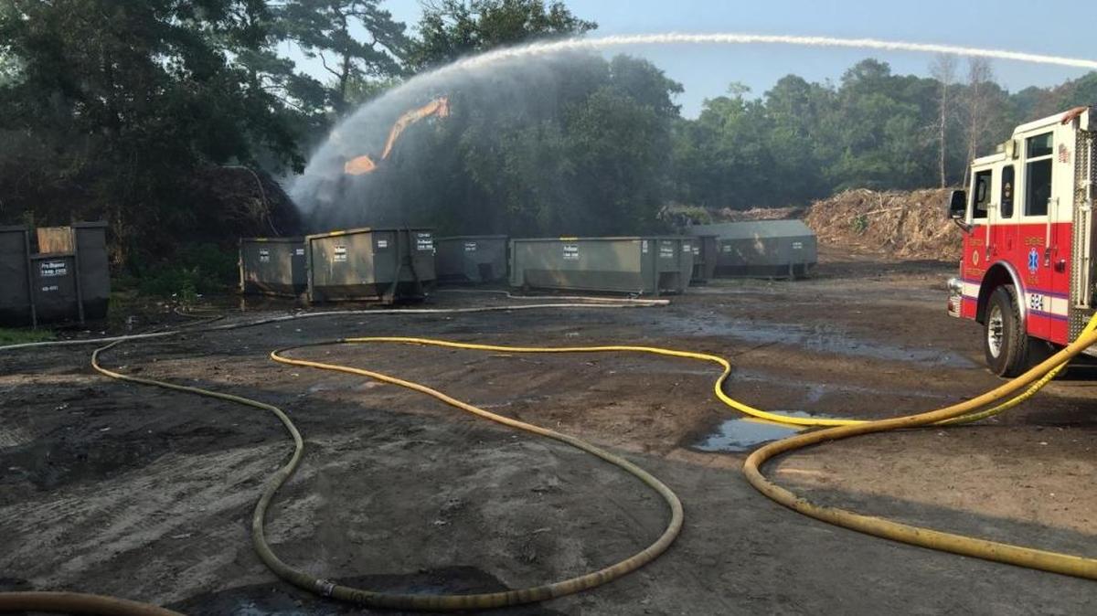 Firefighters worked to extinguish the flames Sunday at Pro Disposal on Bay Pines Road.