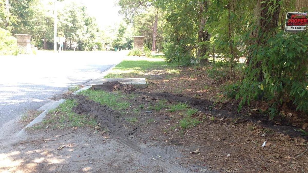Tire ruts are visible on Manny Patlan’s property at 71 Shults Road in Bluffton, where a car ran through his chain-link fence on June 3, 2016, after a fatal shooting near Oscar Frazier Park. Patlan, his sister and his niece were awakened by several gun shots around midnight on June 3.