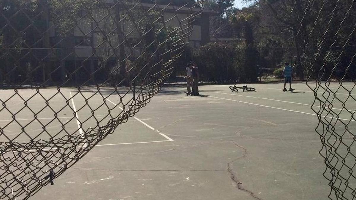 Kids play on the Cordillo Court tennis courts last month. In 2014, the condo complex was the site of more crime reports than any other address in the Forest Beach area. Town officials and community leaders are brainstorming now on ways to improve the tennis court space and make it a better place for neighborhood kids to play and the community to gather.