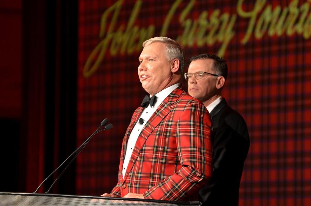 Chamber Board of Directors Chairman Chris McCorkendale (right) looks on as Chamber President and CEO Bill Miles (left) presents an award at the 2018 Hilton Head Island - Bluffton Chamber of Commerce Ball on the island.