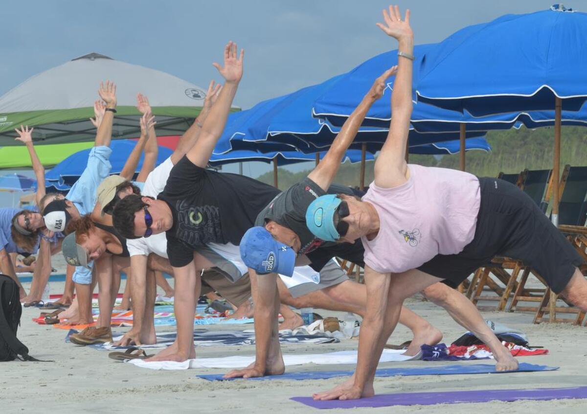 A free beach yoga session on Hilton Head Island’s Coligny Beach near the Tiki Hut.