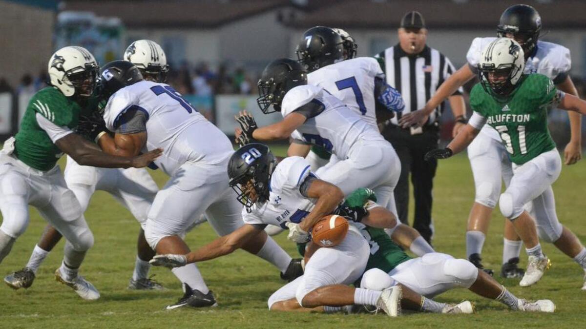 The May River High School Sharks football team plays its first ever game with its crosstown rival, the Bluffton Bobcats, at Bluffton High School on Friday, Aug. 26, 2016.