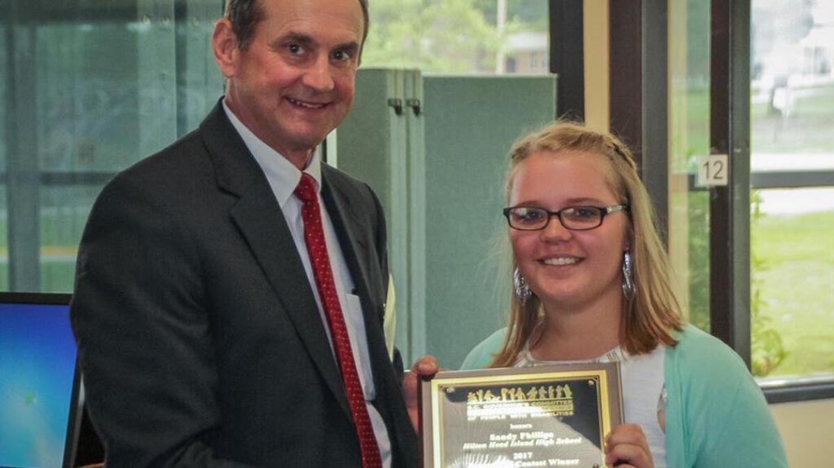 Sandy Phillips is presented her award.