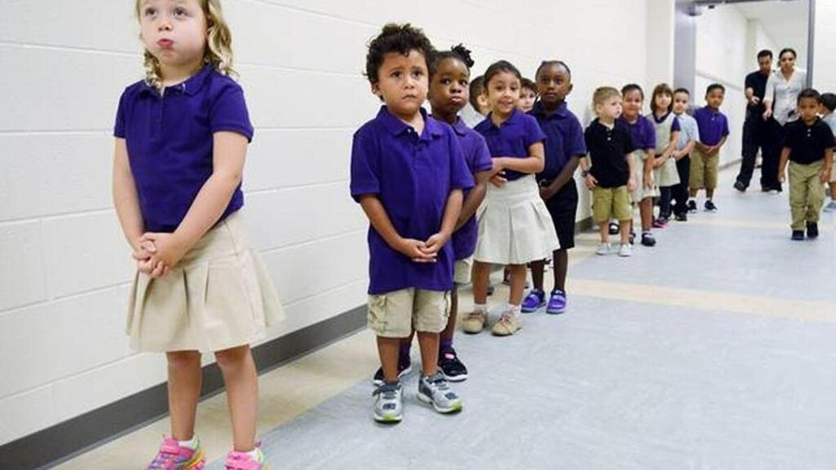 Students line up in the hallway of River Ridge Academy on the first day of the 2015-2016 school year.