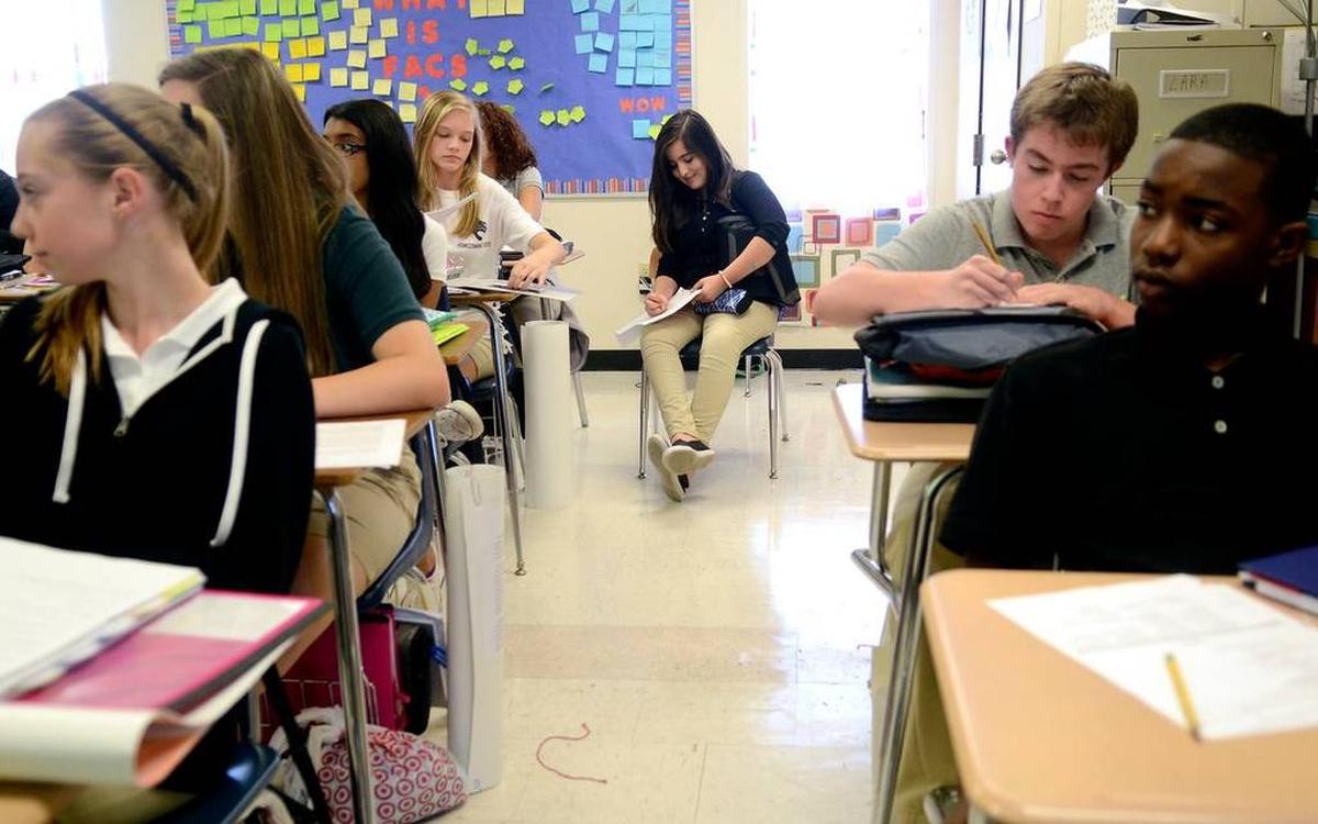 A file photo taken in 2014 shows H.E. McCracken Middle School students learning in a mobile classroom.