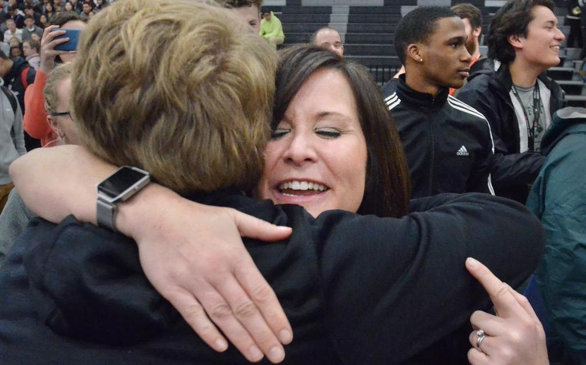 Bluffton High School social studies teacher Erin Reichert receives a hug from a student after it was announced that Reichert is the recipient of the $25,000 Milken Educator Award during a surprise assembly on Thursday. Reichert, who had no idea the award was coming prior to the announcement, was the only South Carolina recipient of this year's award which has been dubbed the “Oscar of teaching.”