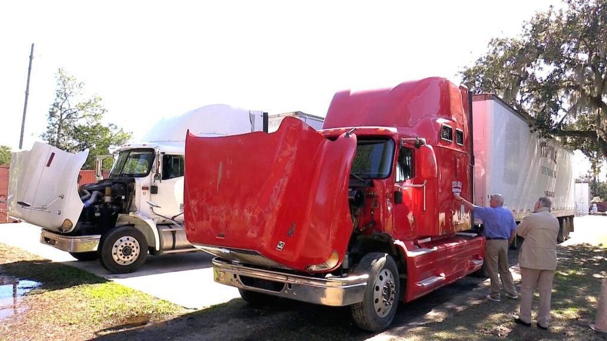 The two tractor-trailer trucks acquired by the Technical College of the Lowcountry after they were delivered to the Beaufort campus on Tuesday. TCL bought the trucks — from Xtra Mile Driver Training in Bishopville, for $25,000 — for its CDL program, set to start in April at the college’s New River and Hampton campuses. Xtra Mile’s owner, Jim Seagle, right, is pictured with William O’Neal, TCL’s program coordinator for continuing education and workforce development.