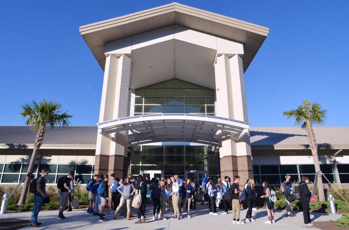 May River High School students stand in front of the school after classes were dismissed on Saturday, which was the second of two Saturday school days scheduled to make up for days lost Tropical Storm Irma in September.
