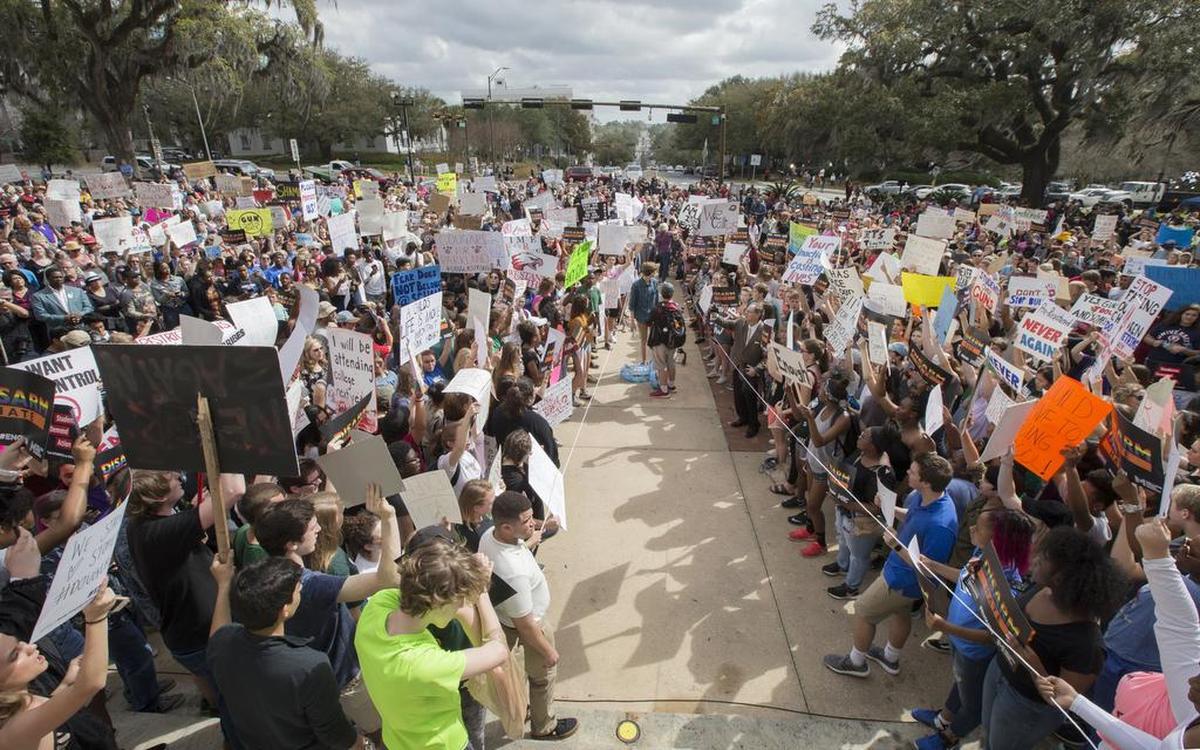 Students gather on the steps of the old Florida Capitol protesting gun violence in Tallahassee, Fla., Wednesday, Feb. 21, 2018. Students at schools across Broward and Miami-Dade counties in South Florida planned short walkouts Wednesday, the one week anniversary of the deadly shooting at Marjory Stoneman Douglas High School.