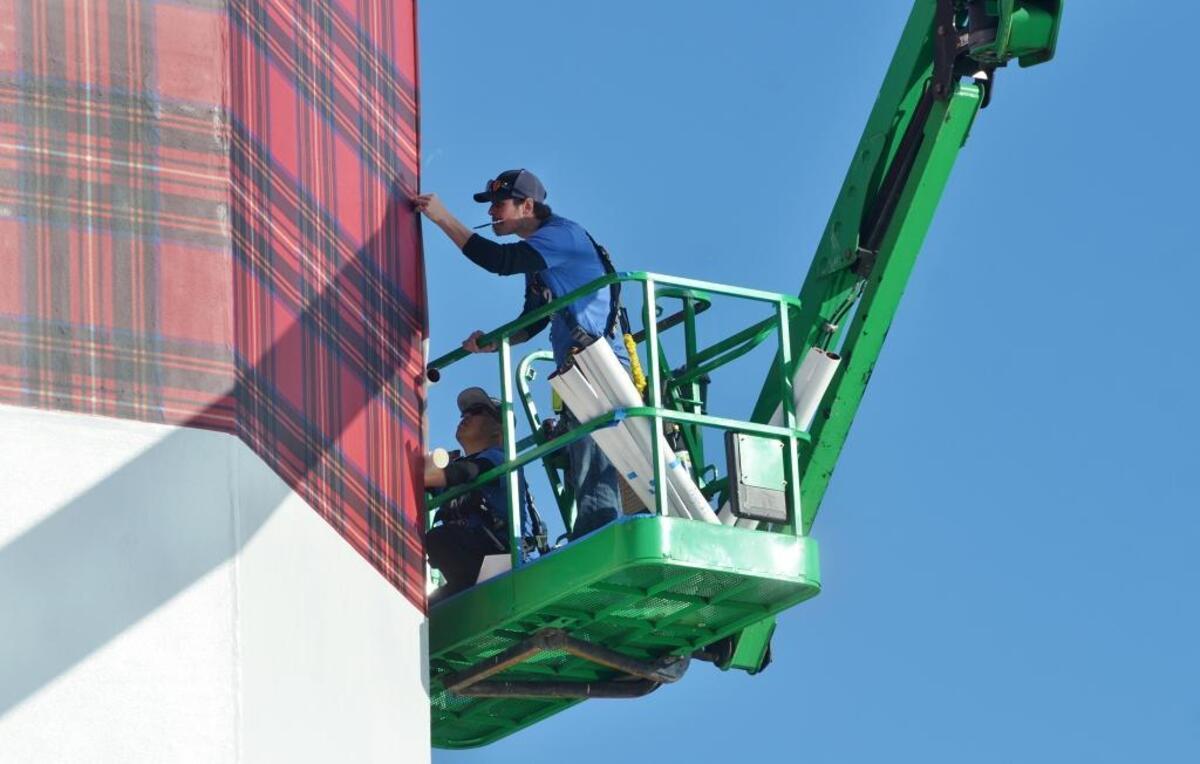 A worker wraps the Harbour Town lighthouse for last year’s 50th anniversary of the RBC Heritage presented by Boeing.