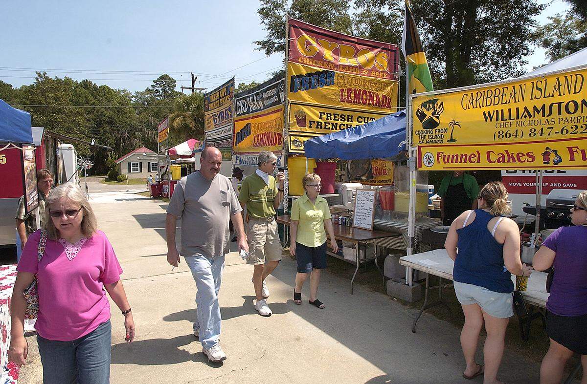 People began showing up early for the annual Yemassee Shrimp Festival on Friday afternoon. The event includes food vendors and the Red Roach Magic Midway with games and rides.