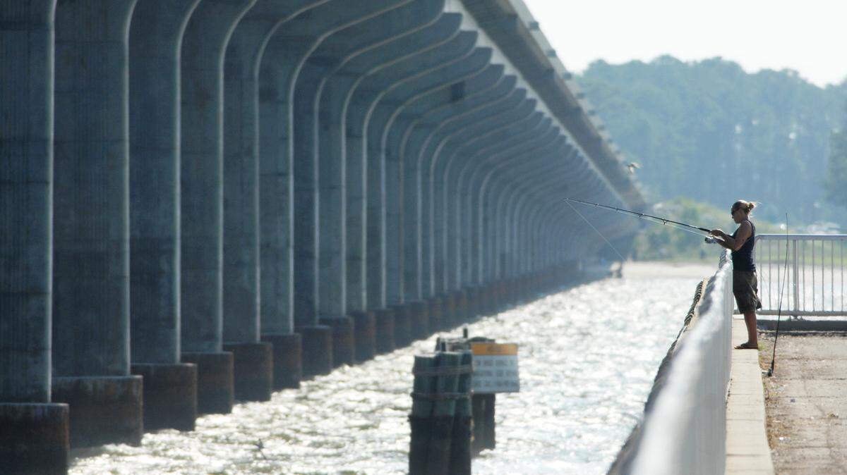 Miranda Ward of Savannah fishes off the Broad River in this file photo.