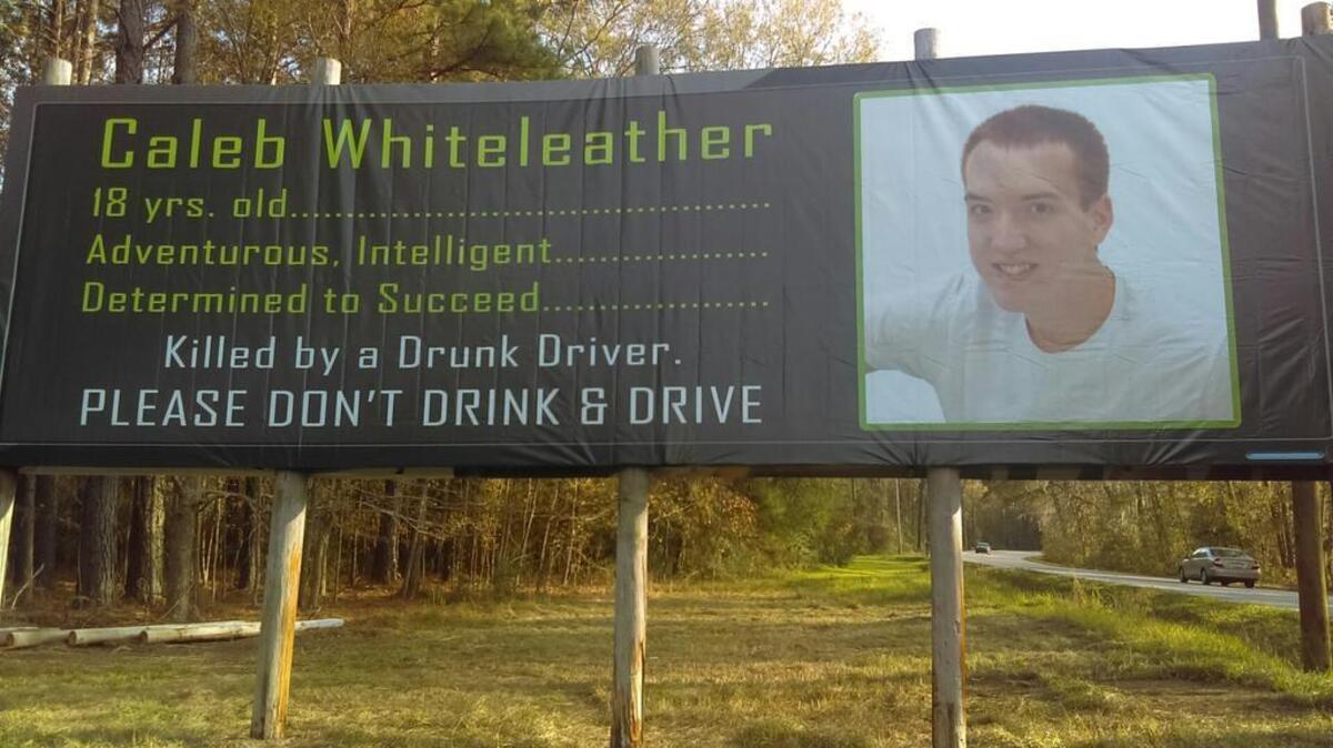 On one side of a billboard, a picture of Caleb Whiteleather sits alongside a list of his attributes.