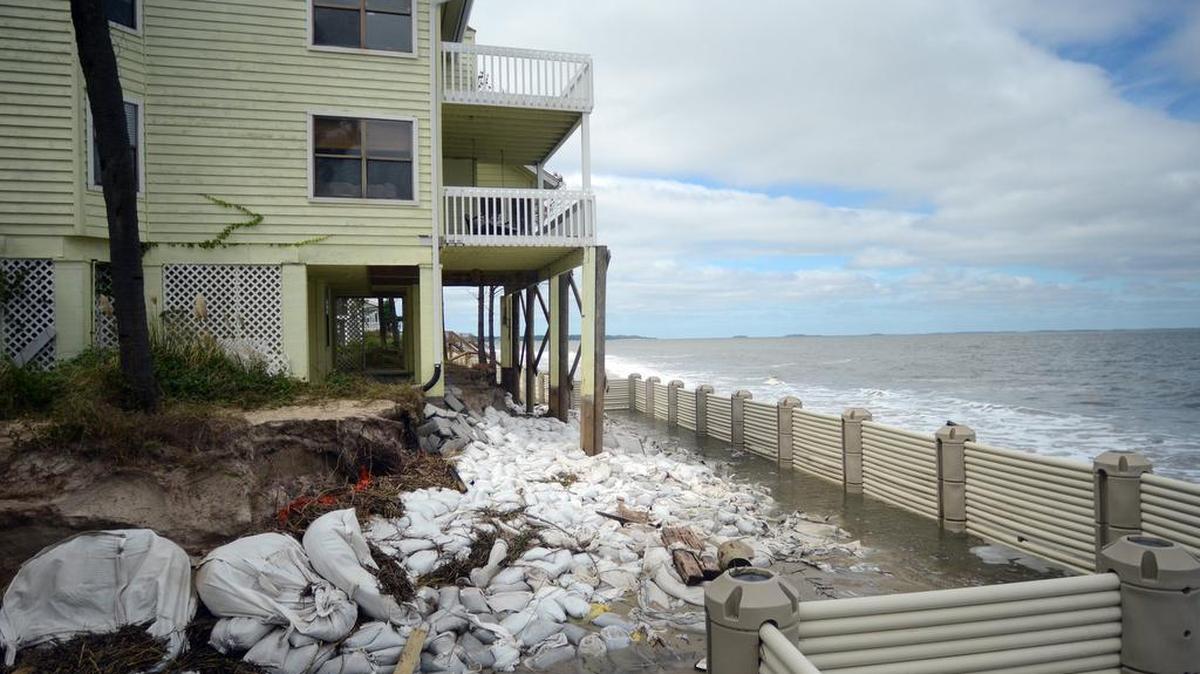 In this file photo from 2015, the Harbor Island home of Tricia and Lew Gardner home is missing much of the beach which was washed away due to high tides and rough waves.