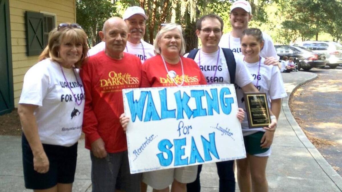 Vanessa Riley, center, serves on the South Carolina chapter of the American Foundation for Suicide Prevention. Over a decade after she lost her son Sean to suicide, she helps organize the Out of the Darkness walk on Hilton Head and connects those who are struggling to counselors.