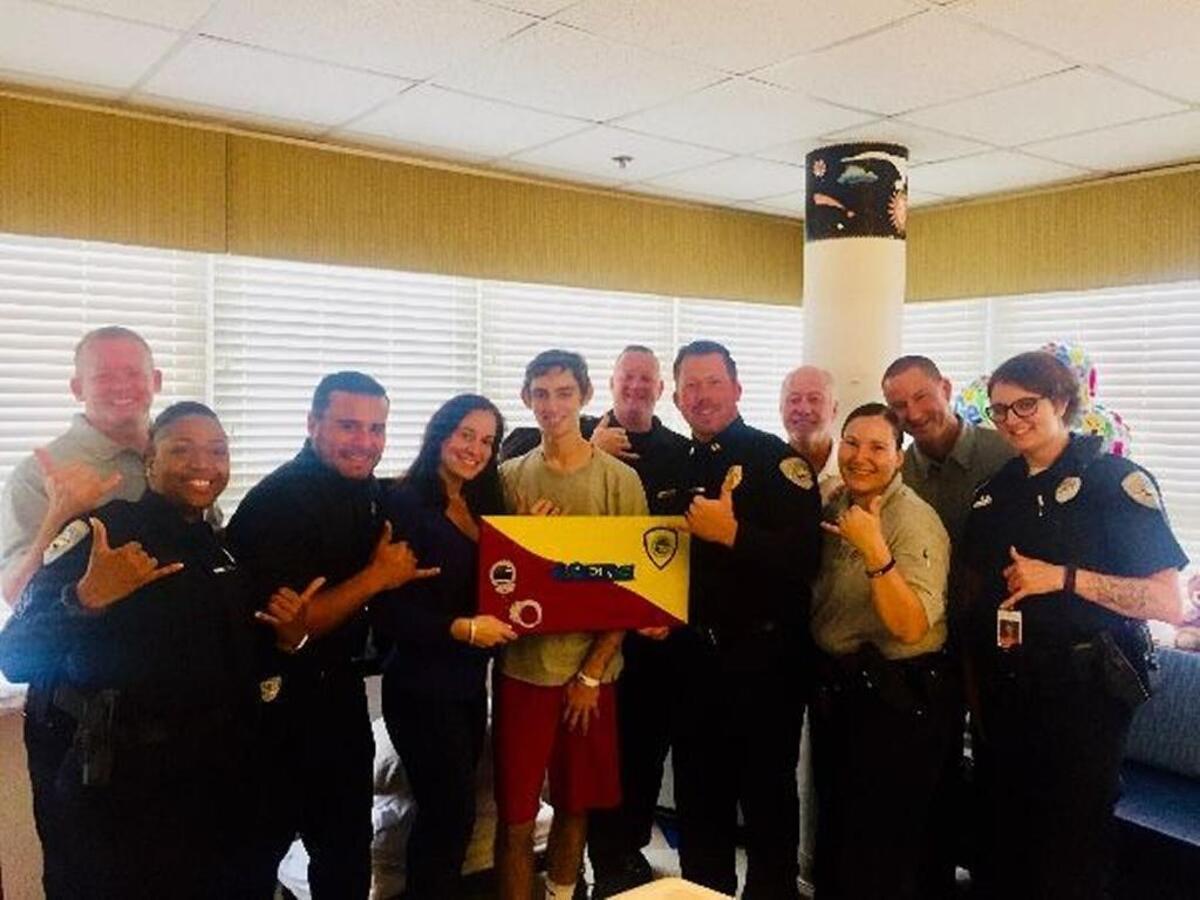 Officers with Bluffton Police Department visit 15-year-old Michael Mugrage in the hospital.