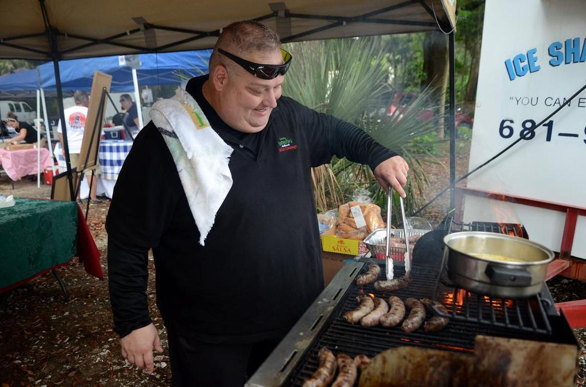 Tom Paige, owner of Grandma Battaglia’s Authentic Italian Sausage, preps some of his Italian sausages to be served during the last year’s Bluffton Sunset Party Pizza and Pasta Palooza night at Oyster Factory Park in Bluffton.