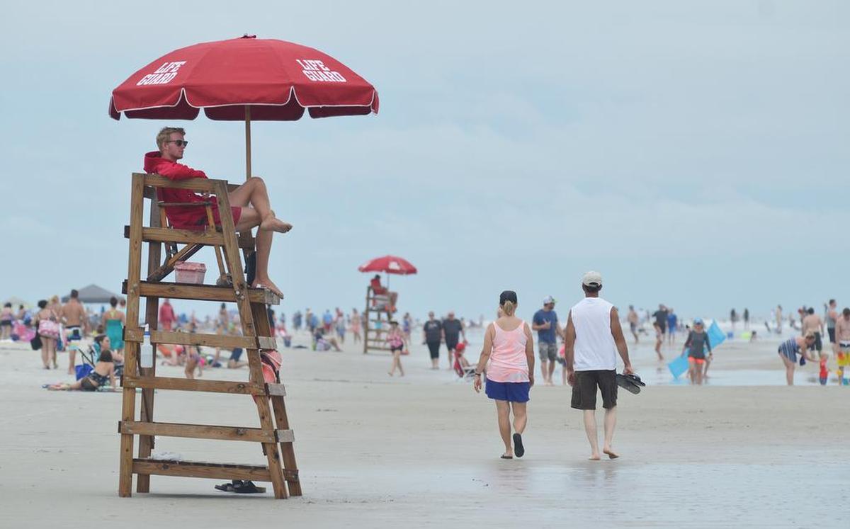 A Shore Beach Service lifeguard keeps watch over swimmers at the beach in a file photo from July 2017.