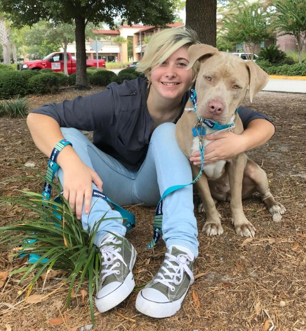 Naomi Gosdin and her service pitbull Twinkie.