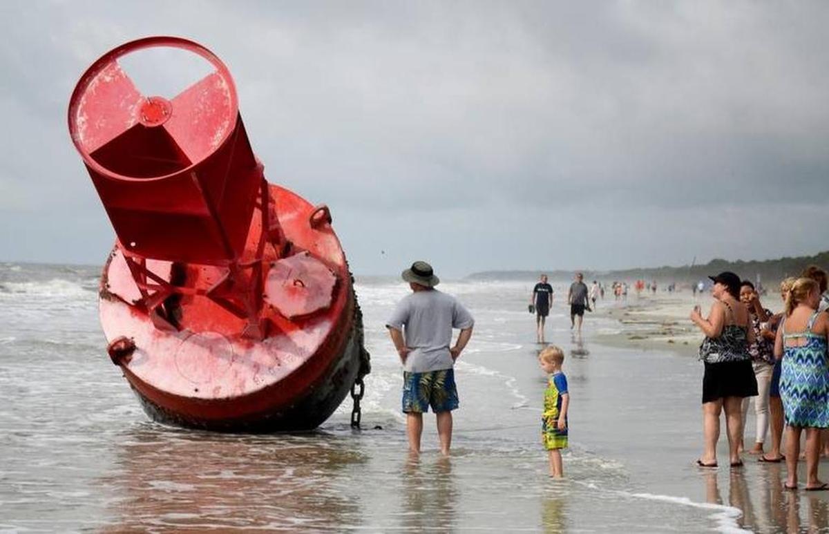 Residents and visitors admire the accidental Hilton Head Island tourist attraction, which was deposited on Hilton Head Island by Tropical Storm Irma.