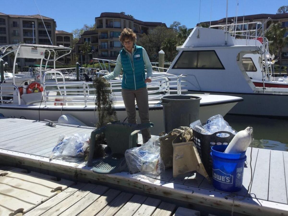 Dr. Jean Fruh explains how a casting net like the one a young volunteer found on in Broad Creek on Sunday can harm or kill local wildlife that might mistake it for food or get caught in it.