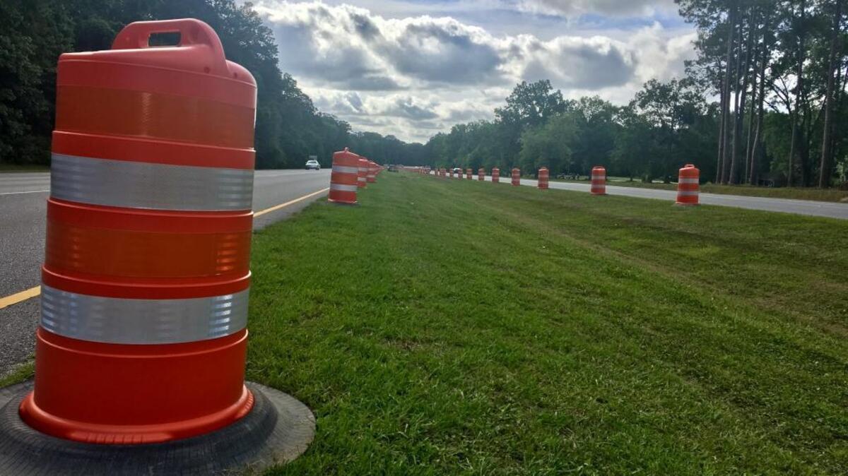 Traffic barrels line a stretch of U.S. 278 Friday in preparation for an upcoming landscaping project.