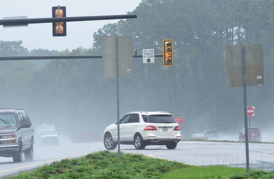 A vehicle makes a left turn through a break in oncoming traffic on the blinking yellow left turn light from westbound U.S. 278 onto Buck Island Road on Thursday morning.