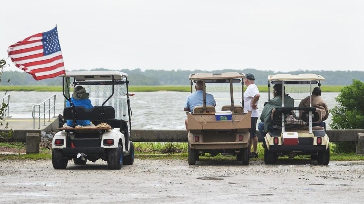 Blufftonians gather in their golf carts to watch the wind generated by Tropical Storm Hermine in September 2016. Golf carts are common on the streets in Bluffton.