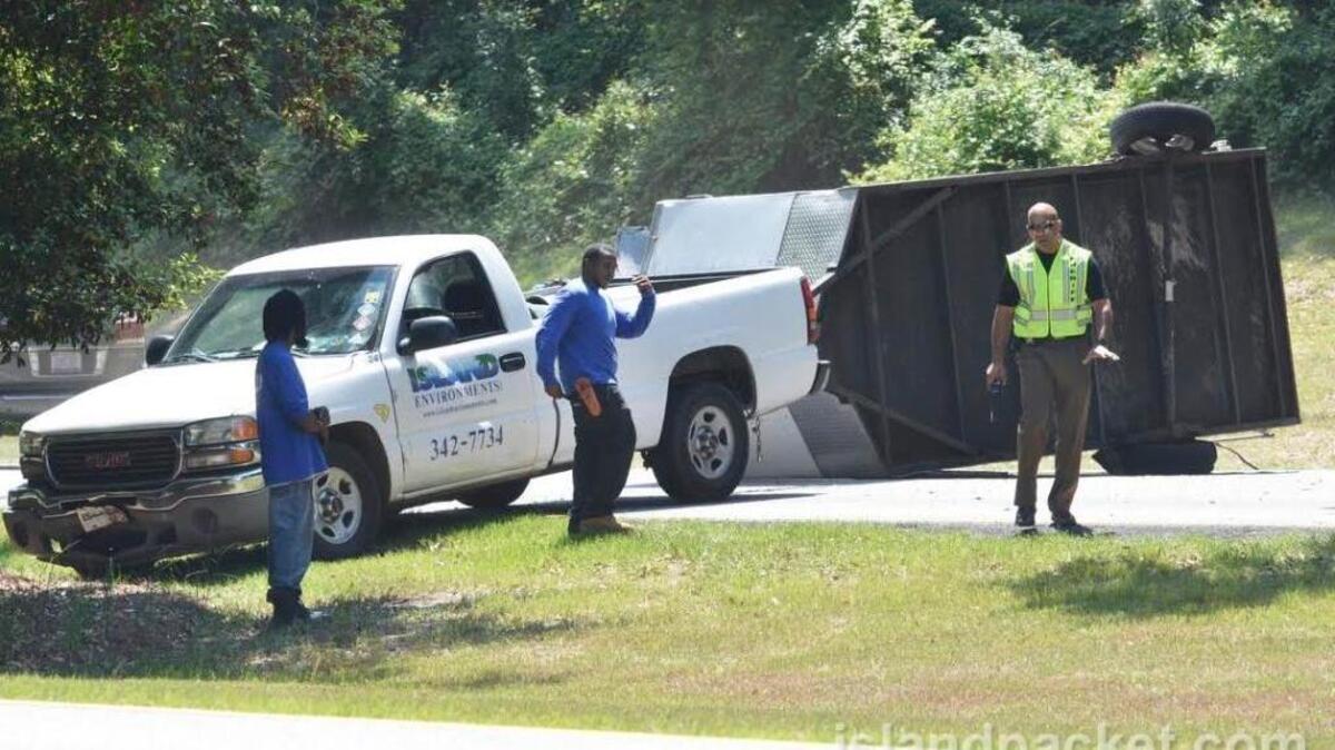 This Island Environments landscaping truck and trailer came to rest across both lanes of eastbound William Hilton Parkway near the Jenkins Road intersection after colliding with another vehicle on Wednesday. The accident caused a backup for traffic heading onto Hilton Head Island.