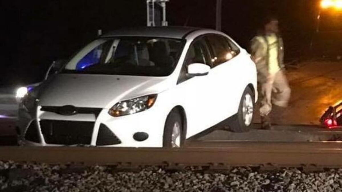 A driver trying to go around the gates at a railroad crossing in Yemassee became stuck and now faces charges.