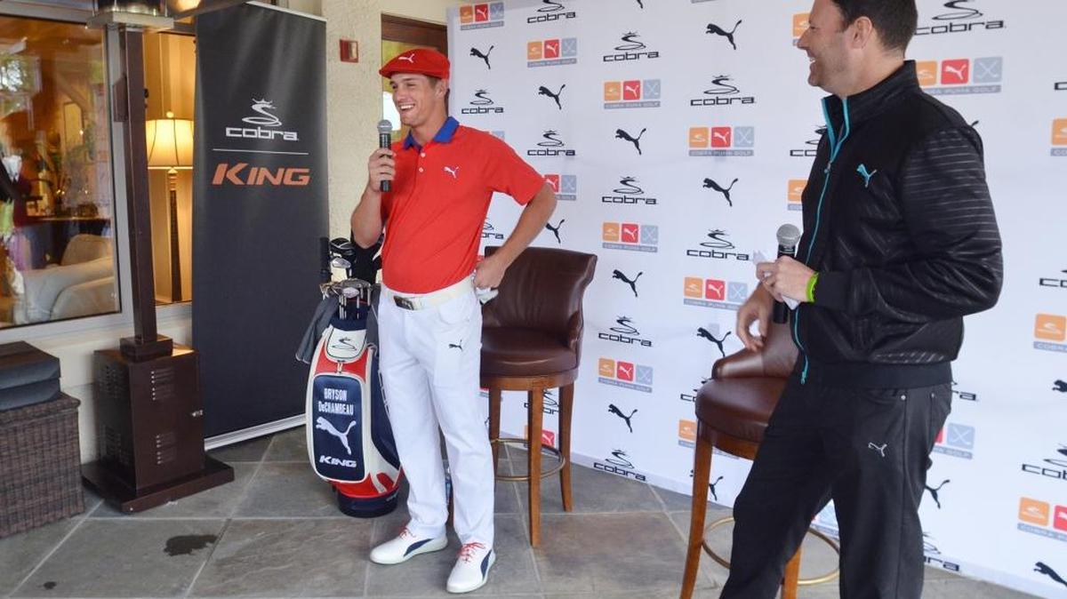 RBC Heritage Presented by Boeing competitor Bryson DeChambeau shows off his new clubs and models his new golf attire during a press conference on Tuesday at The Inn at Harbour Town. The press conference was held so DeChambeau, who is turning professional at the Heritage, could announce his first sponsorship with Cobra Puma Golf. Puma President and CEO Robert Philion looks on at right.