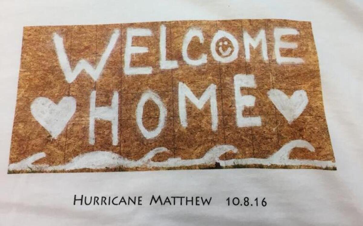T-shirt of the Hilton Head “Welcome Home” sign from Hurricane Matthew will raise money for the Deep Well social services agency.