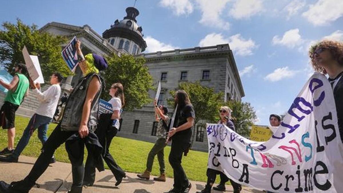 The Trans Student Alliance at USC held a rally and press conference at the State House to protest the S. 1203 bill that would have banned transgender people from choosing the bathroom they use.