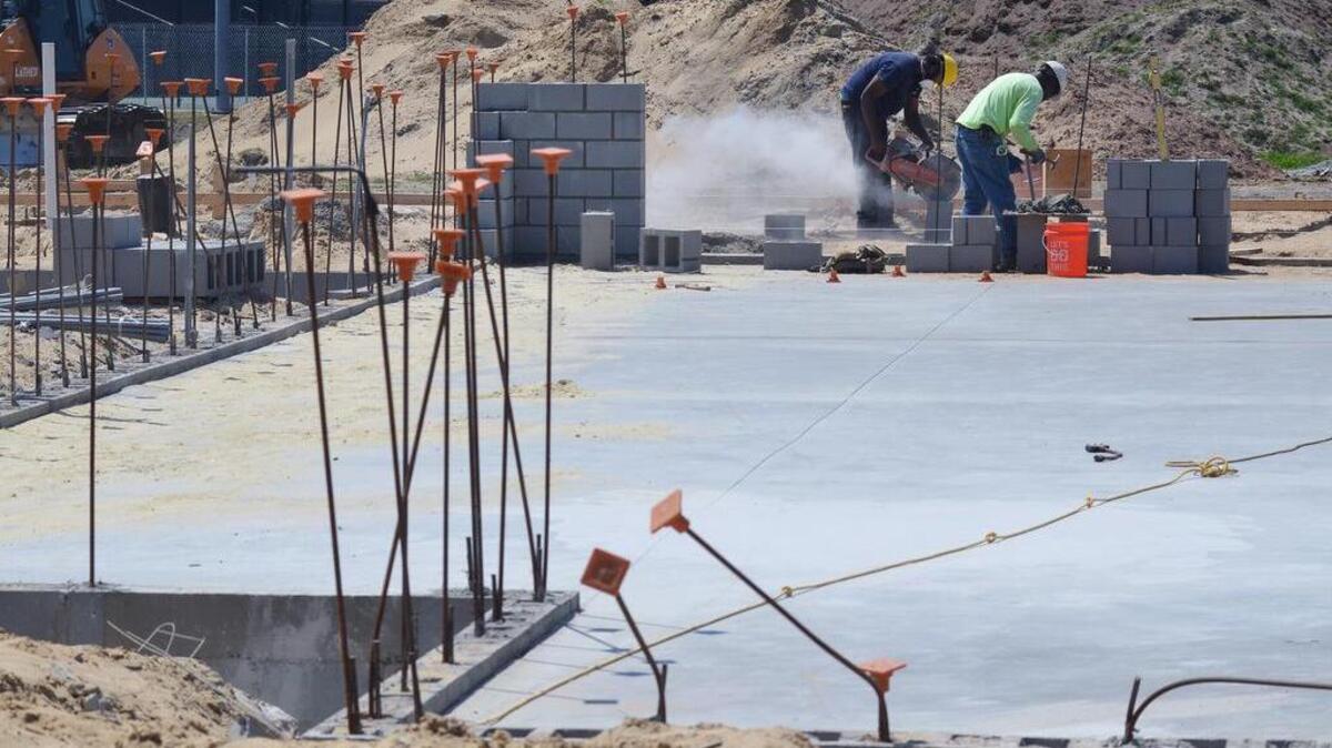 A new concrete slab has been laid in an area formerly occupied by an athletic field as work on the expansion of the Island Recreation Center continues on May 11, 2017.