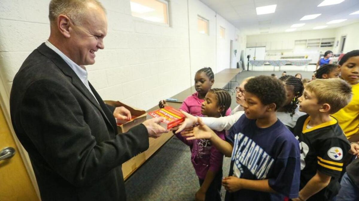Retired Army Col. Bryan Hilferty volunteers by delivering dictionaries to the third graders at Manchester Elementary school in Pinewood, SC. Hilferty and his fellow SC veterans are not exempted from state income tax. Some states, like North Carolina, have exempted veterans from state income tax to entice them to retire there, bringing their expertise and future paychecks and day to day spending with them. SC has not, and the bill is one identified by the DOD that will figure in to future BRAC rounds.
