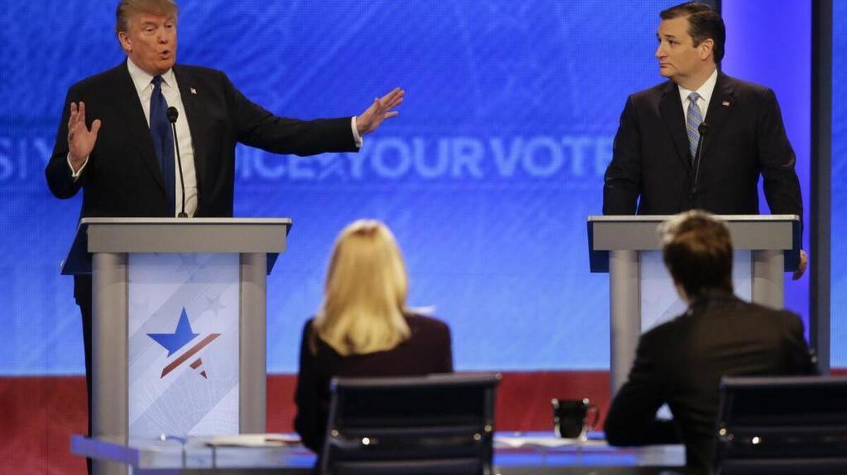 Republican presidential candidate, businessman Donald Trump answers a question as Republican presidential candidate, Sen. Ted Cruz, R-Texas, listens during a Republican presidential primary debate hosted by ABC News at the St. Anselm College on Feb. 6, 2016, in Manchester, NH.