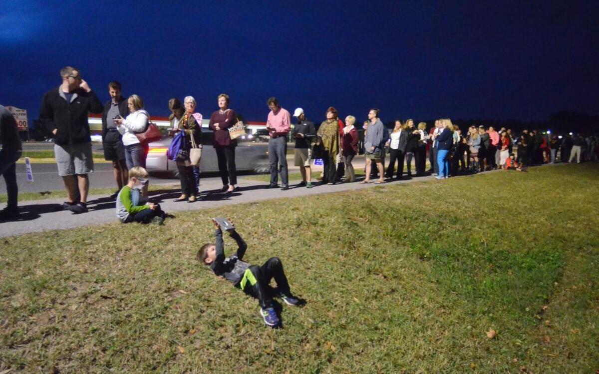 Voters stand in line on the shoulder of Buckwalter Parkway in Bluffton the evening of Nov. 8, 2016, where the wait at the general election polling place at Lord of Life Lutheran Church — serving seven precincts — was nearly two hours. The line extended from the church entrance, through the parking lot and then ran another 100 yards down the side of the parkway. Most voters, however, seemed to be taking the wait in stride.