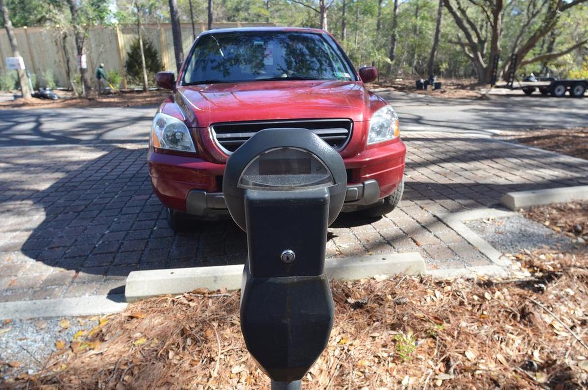 A car is parked at one of the metered spaces available to the public at Islanders Beach Park on Hilton Head Island on Feb. 24, 2017. Most of the spaces in the park are reserved for island residents with town beach parking passes.