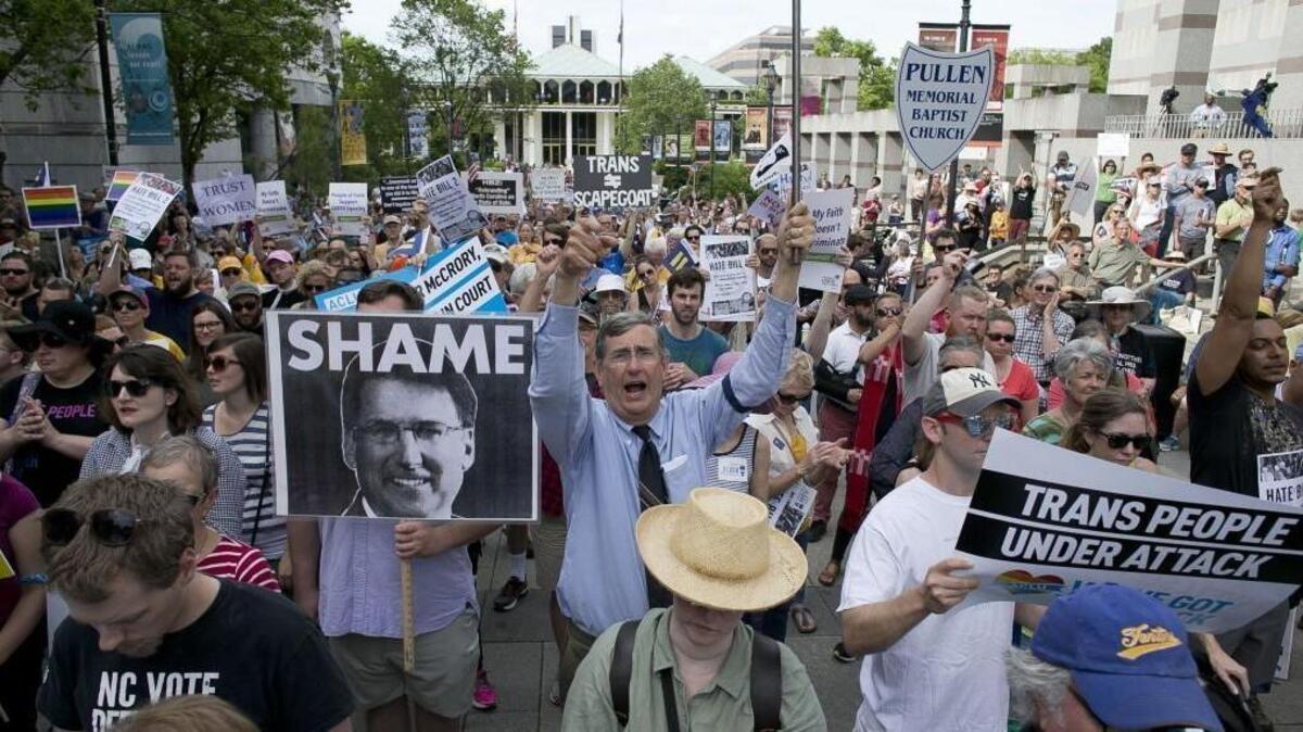 John Chase of Durham, N.C., center, follows the chants of North Carolina NAACP President Rev. William Barber during a rally last month in opposition of House Bill 2 in Raleigh, N.C.
