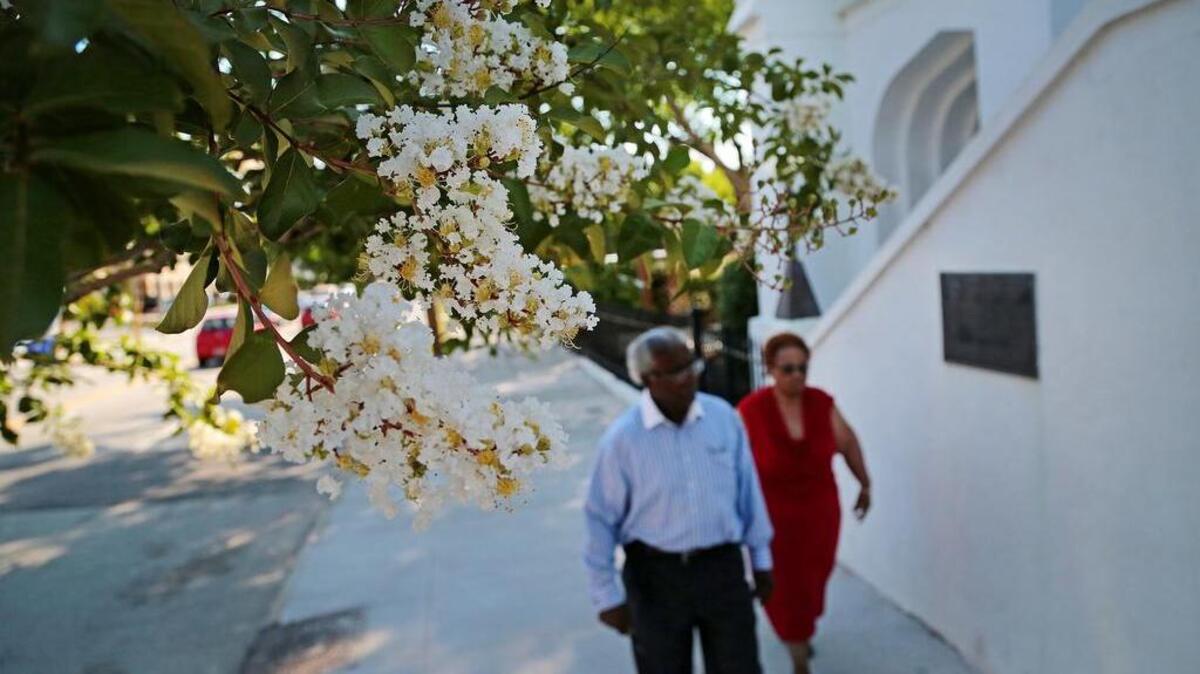 A man and woman walk past Emanuel AME Church on Charleston’s Calhoun Street on June 10, 2016.