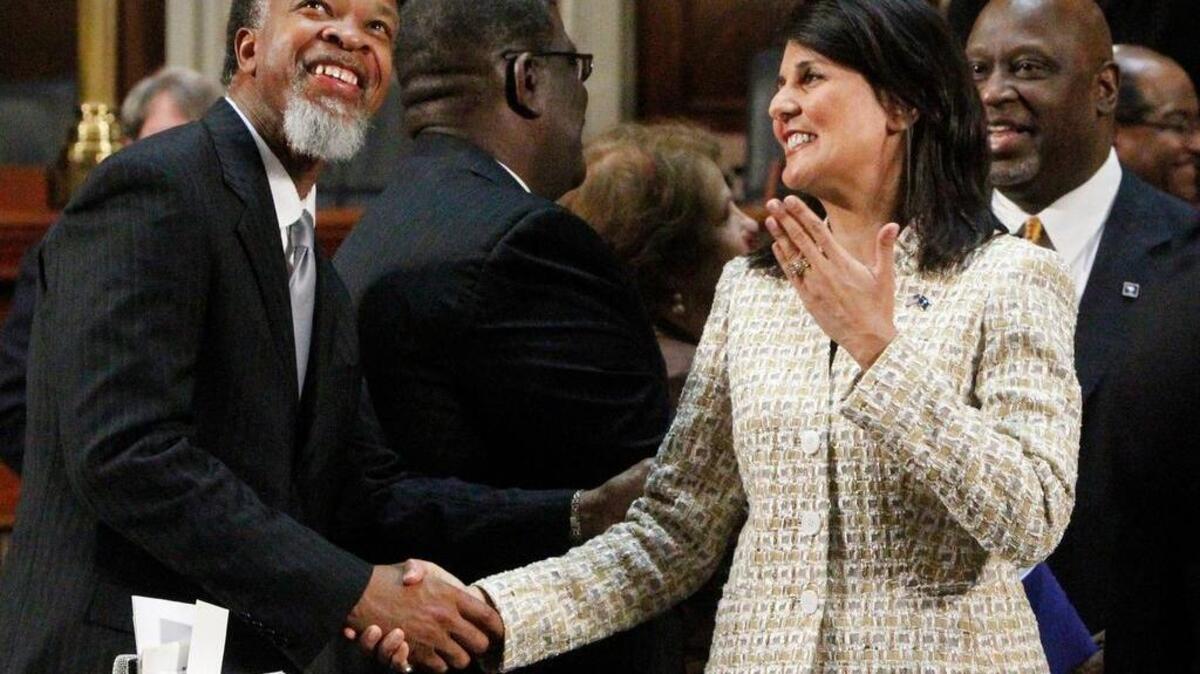 South Carolina Gov. Nikki Haley greets Rep. Ronnie Sabb, D-Williamsburg, inside the SC House Chamber after delivering her 2016 State of the State address.