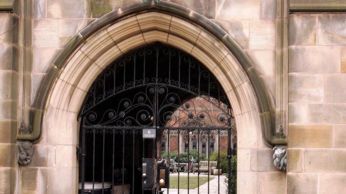 This Feb. 2, 2007, file photo shows a rear gate at Calhoun College, one of Yale's 12 residential colleges for undergraduates. On Feb. 11, Yale University said it is renaming Calhoun College after Grace Hooper, a trailblazing computer scientist, a mathematician who earned Yale degrees in the 1930s, invented a pioneering computer programming language and became a Navy rear admiral.