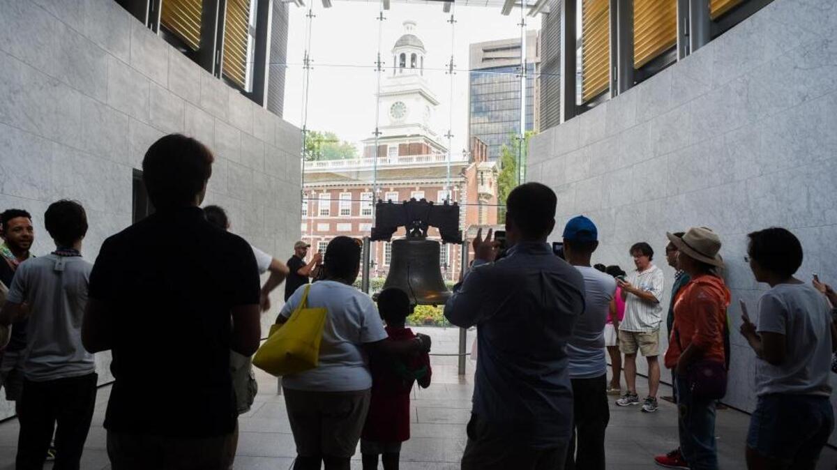 Tourists in Philadelphia on Wednesday crowd around the iconic Liberty Bell in the shadow of Independence Hall.