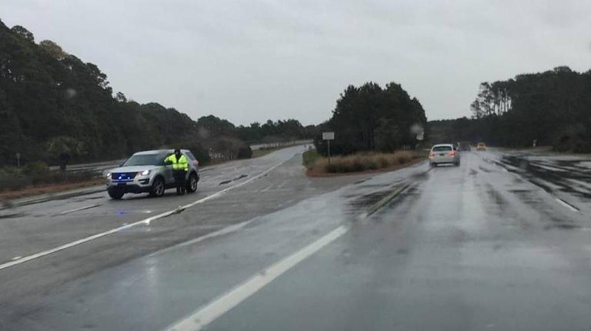 A deputy blocks the eastbound lanes of the Cross Island Parkway ramp at Gumtree Road.