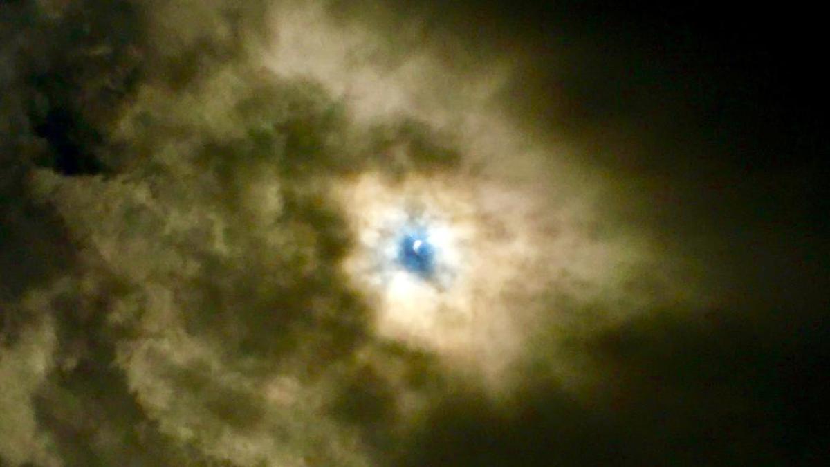 In almost perfect timing, John Chiacchiero took this photo on Monday when the clouds popped open revealing the start of the eclipse.