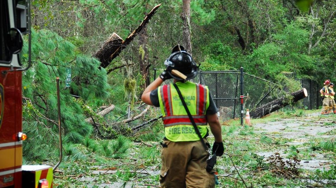 A firefighter surveys damage caused by Hurricane Matthew near Hilton Head Island Airport on Oct. 8, 2016.