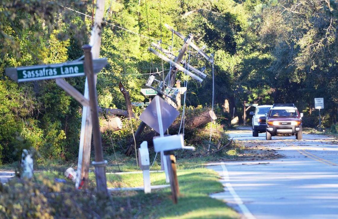 A row of power poles knocked down by Hurricane Matthew are photographed along Spanish Wells road near Sassafras Lane on the evening of Oct. 9, 2016.