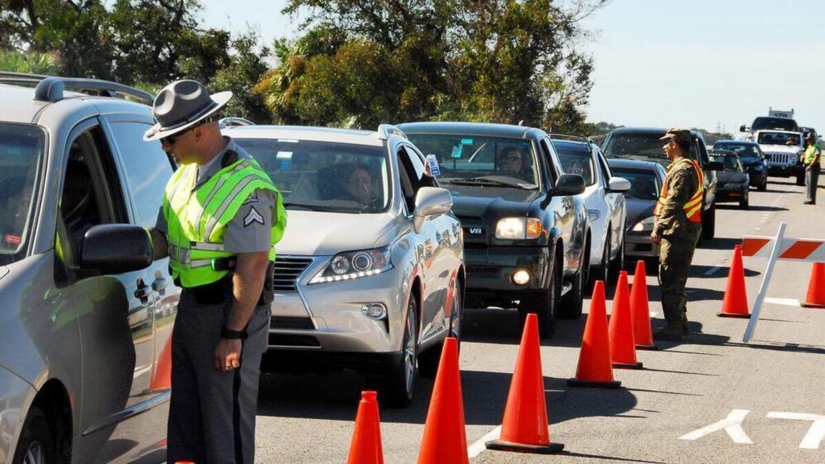 Cars line up at the Hilton Head Island checkpoint on Monday, Oct. 10, 2016 after Hurricane Matthew hit the southeast coast.