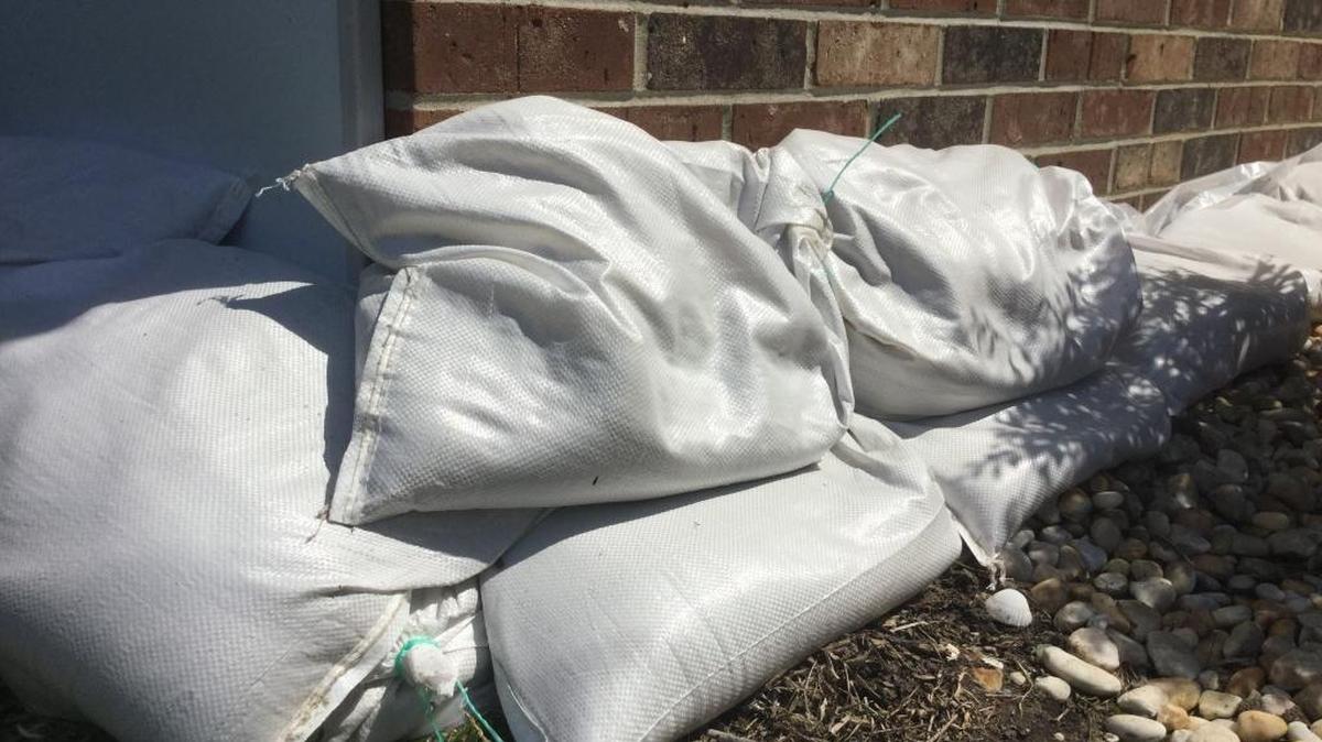 Sandbags are stacked along the foundation of a Beaufort home on Thursday, September 7, 2017.