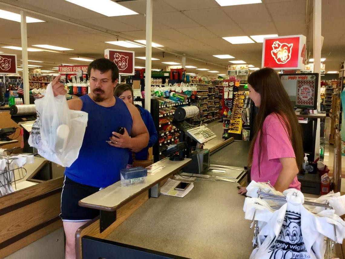 Shoppers check out on Saturday at Piggly Wiggly on North Forest Beach Drive on Hilton Head Island.